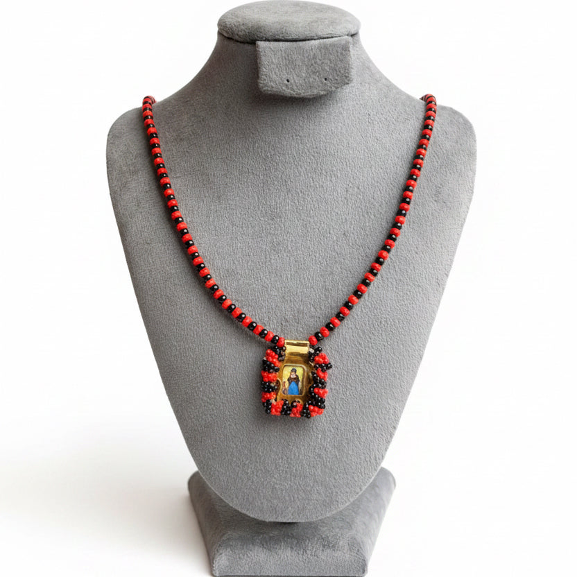 Collar niño de atocha